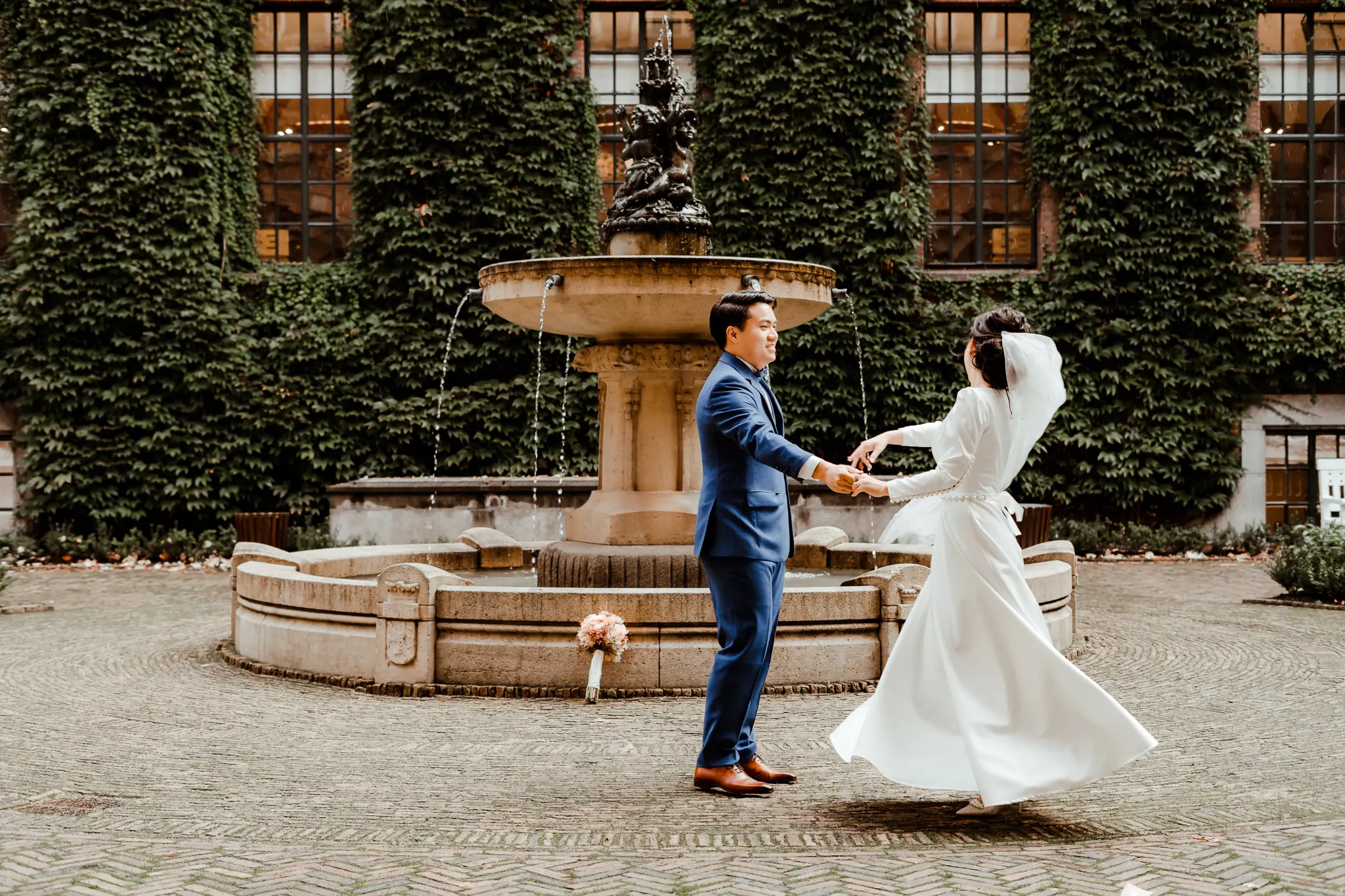 Bride and groom dance in City Hall Garden Rotterdam