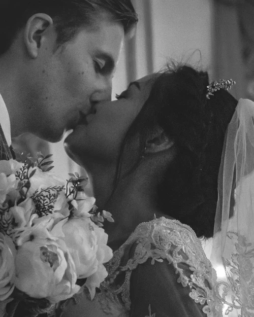 kissing portrait of bridal couple