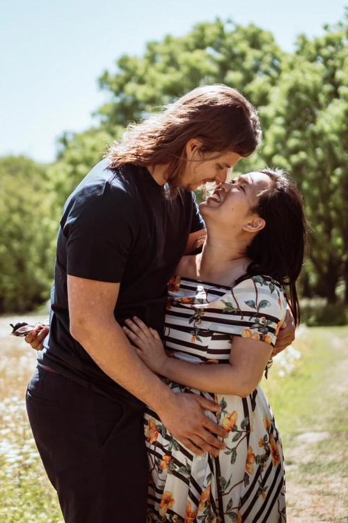 a close-up of a happy couple looking into each other's eyes