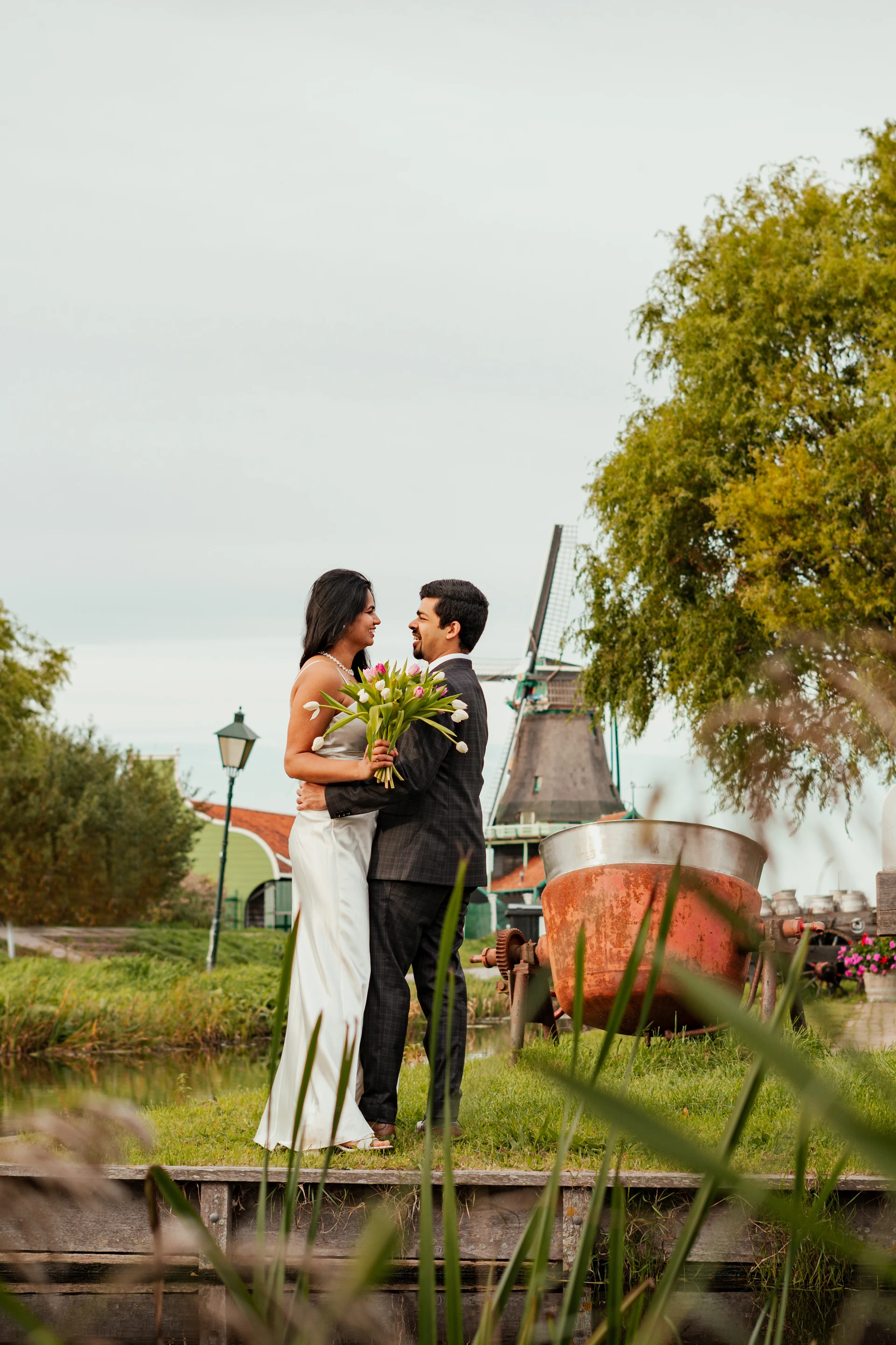 Wedding photoshoot with windmills and tulips near Amsterdam