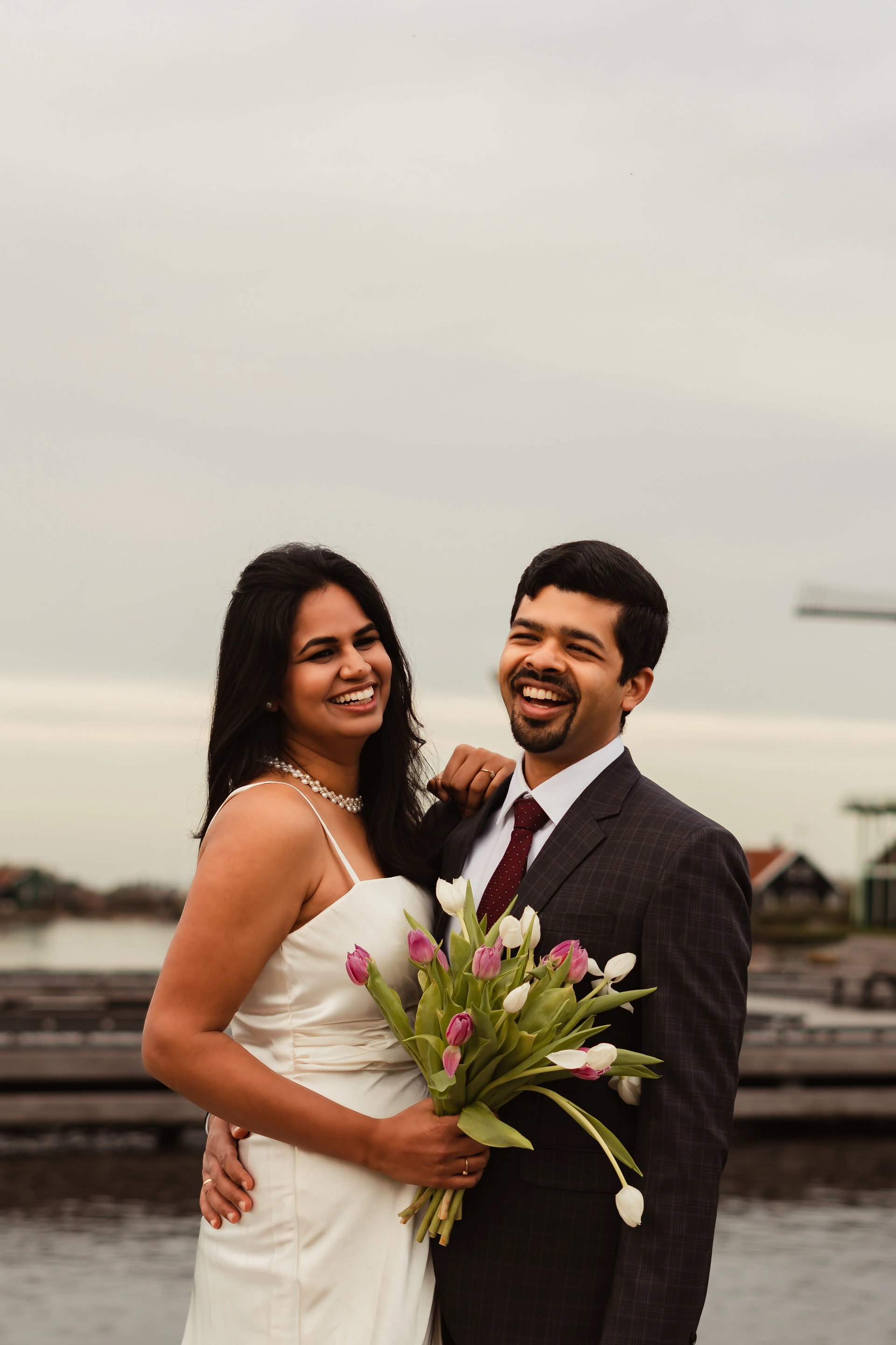 Warm wedding photo of a couple taken in Zaanse Schans the Netherlands